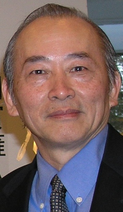 Xu Wenli wearing a suit and tie.